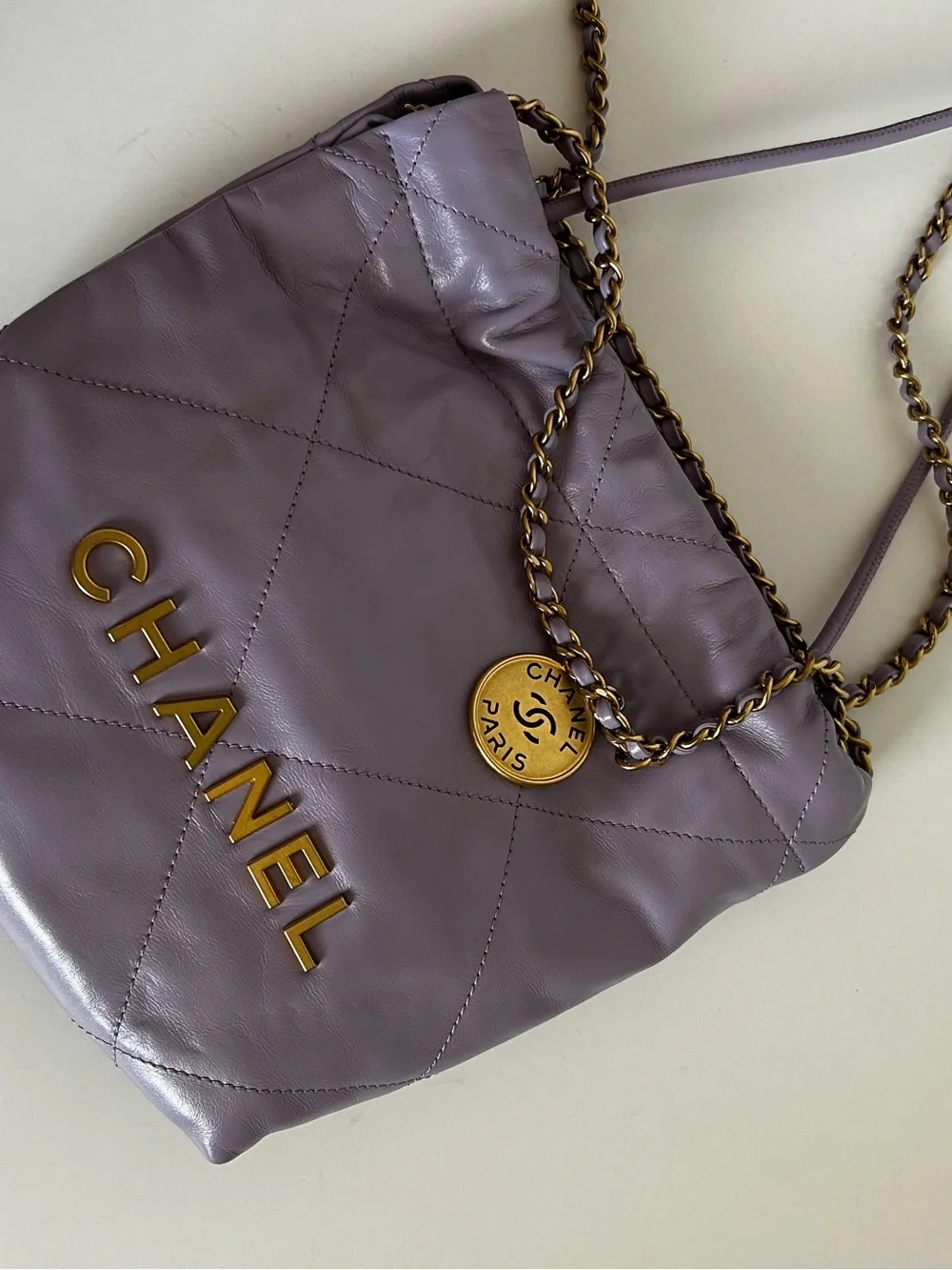 CHANEL Mini 22 Lavender Quilted Leather Crossbody with Gold Logo Medallion